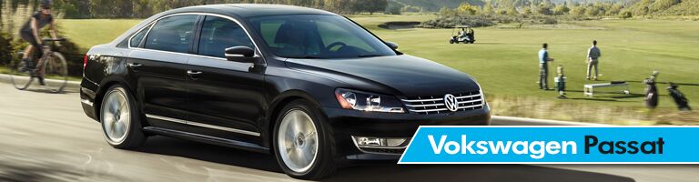 black 2018 Volkswagen Passat driving down country road