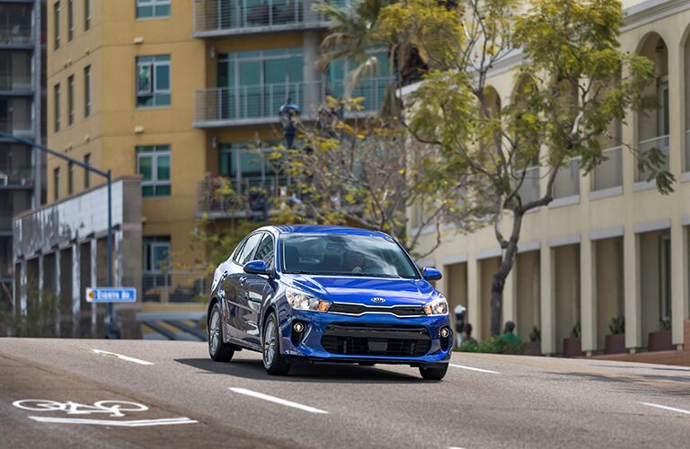 2018 Kia Rio driving down the road.