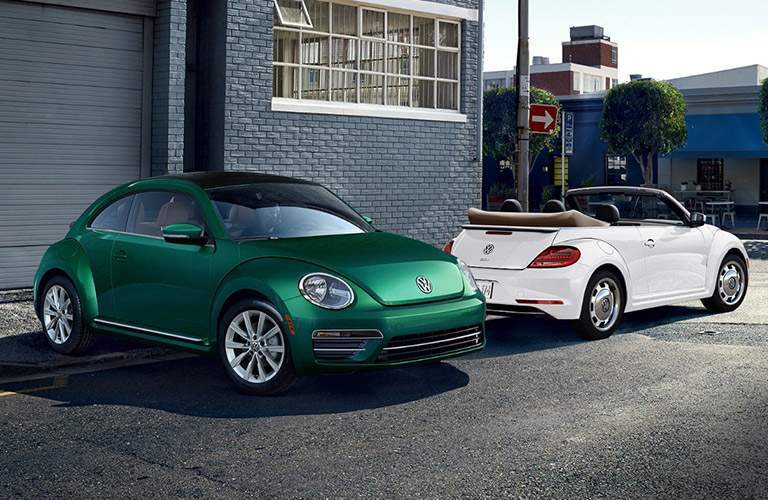 2018 Volkswagen Beetle and 2018 Volkswagen Beetle Convertible parked together in a parking lot