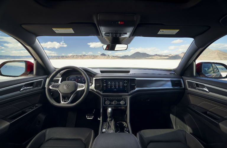 A photo of the dashboard and driver's cockpit in the 2021 Volkswagen Atlas Cross Sport.