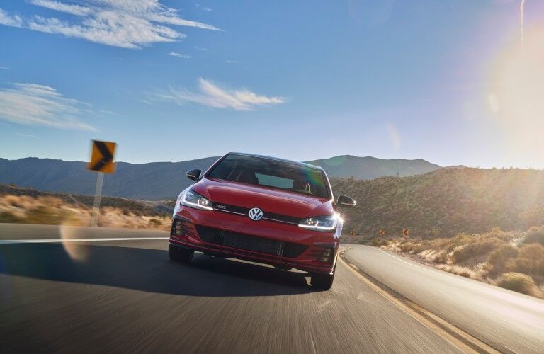 A head-on photo of the 2021 Volkswagen Golf GTI on the road.