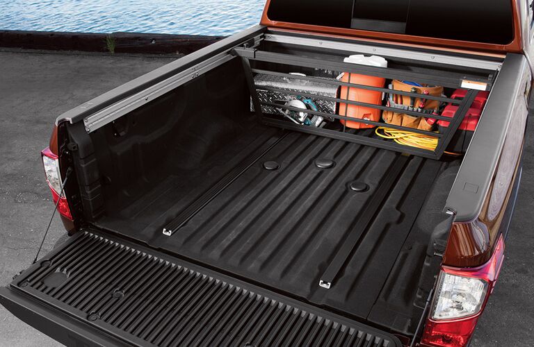 rear truck bed of 2018 nissan titan xd with liftgate down and cargo storage
