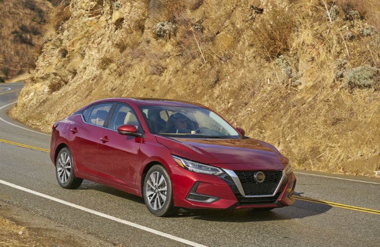 A photo of the 2020 Sentra coming around a curve.