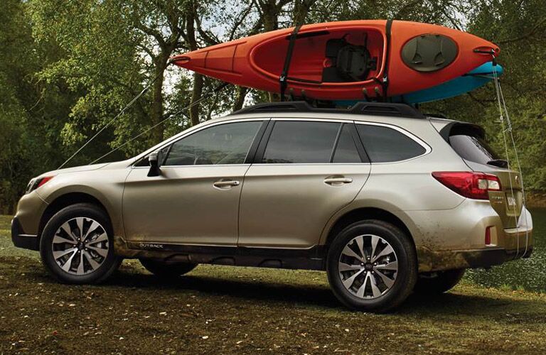 Subaru Outback loaded with kayaks
