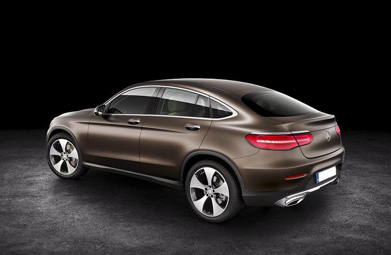 brown 2017 Mercedes-Benz GLC seen from the side against a black background