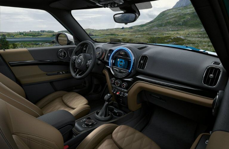 Leather appointed interior of 2018 MINI Cooper Countryman with steering wheel and center touchscreen