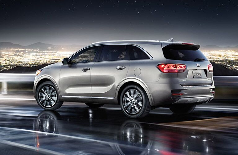 Silver 2017 Kia Sorento Rear Exterior with city lights in the background