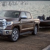 A Toyota truck towing a boat