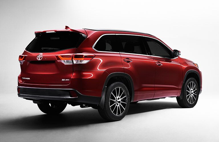 red 2017 Toyota Highlander rear side profile
