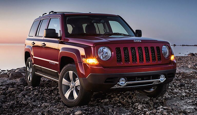 red 2016 Jeep Patriot on the beach