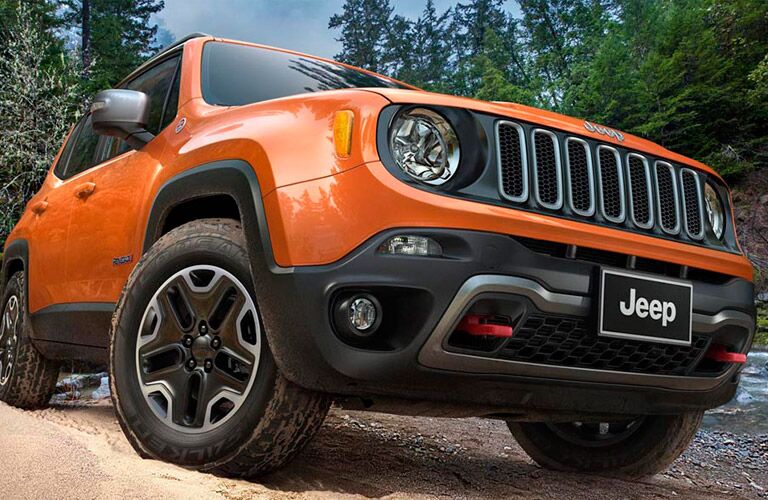 front of an orange 2016 Jeep Renegade
