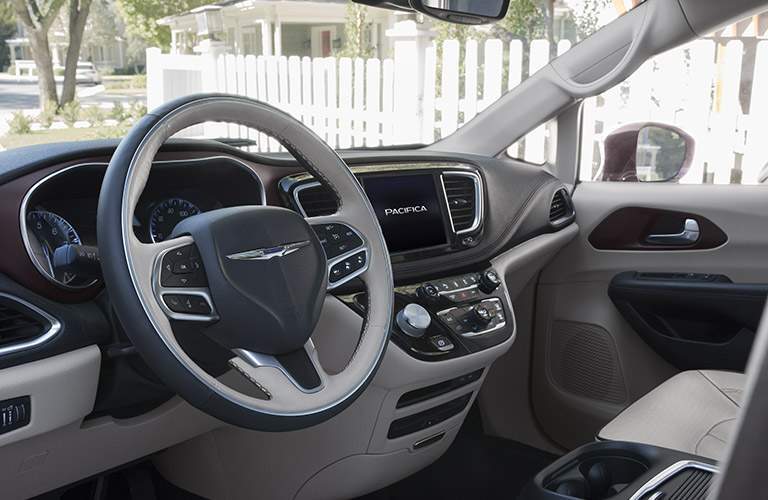 slightly side view of the steering wheel and infotainment system of the 2017 Chrysler Pacifica