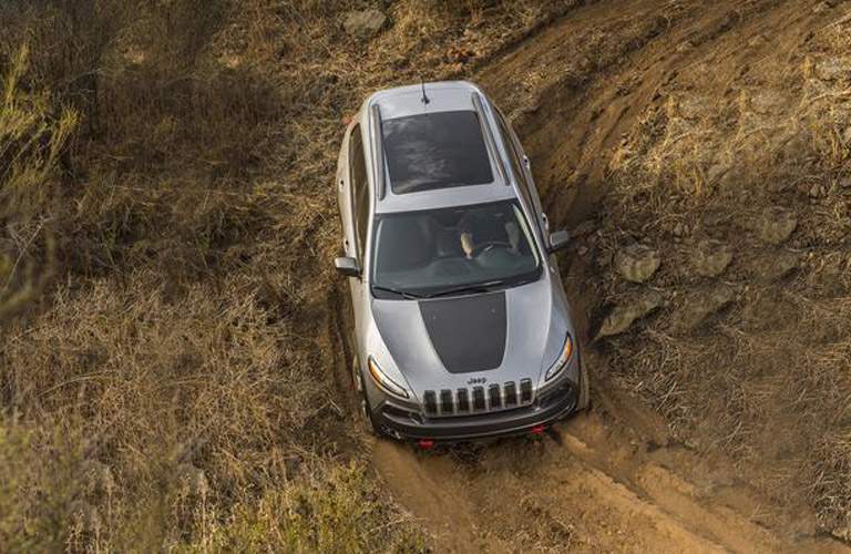 2018 Jeep Cherokee driving on a dirt track