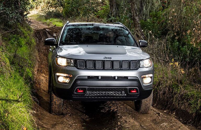 front of the 2019 Jeep Compass Trailhawk in the wilderness
