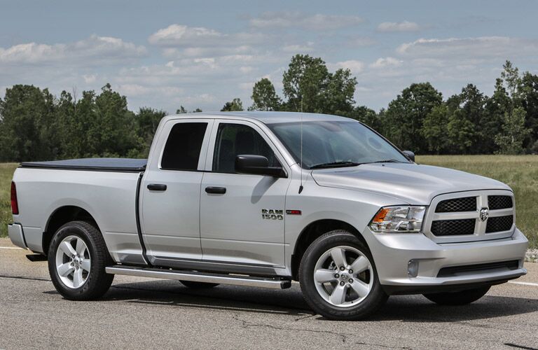 pale 2016 Ram 1500 on the road