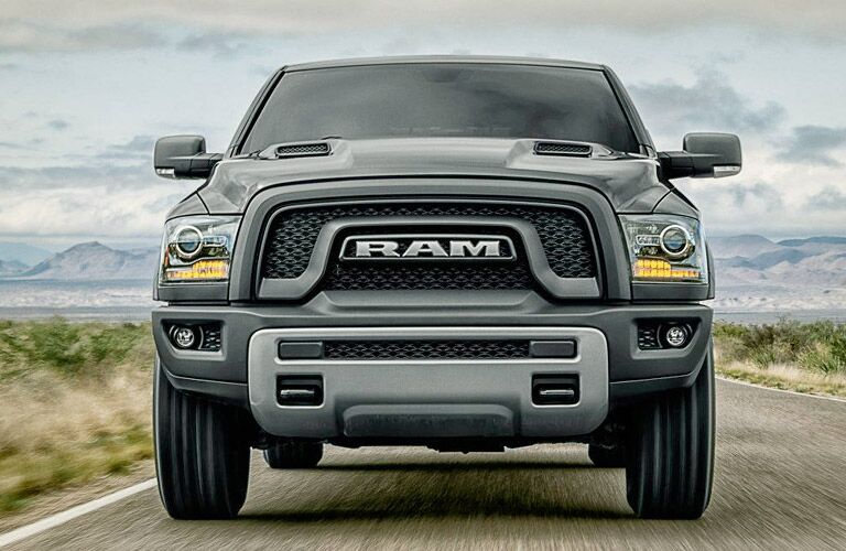 front view of a black 2017 Ram 1500 driving toward the camera