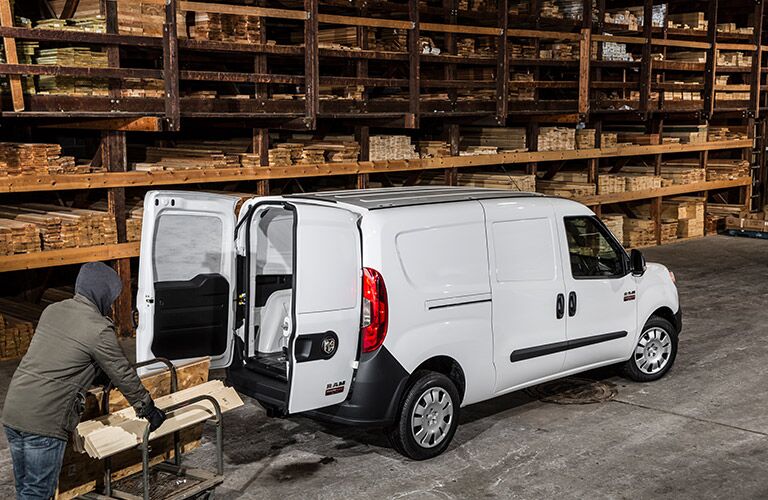 lumber being loaded into the 2017 Ram ProMaster City in a warehouse