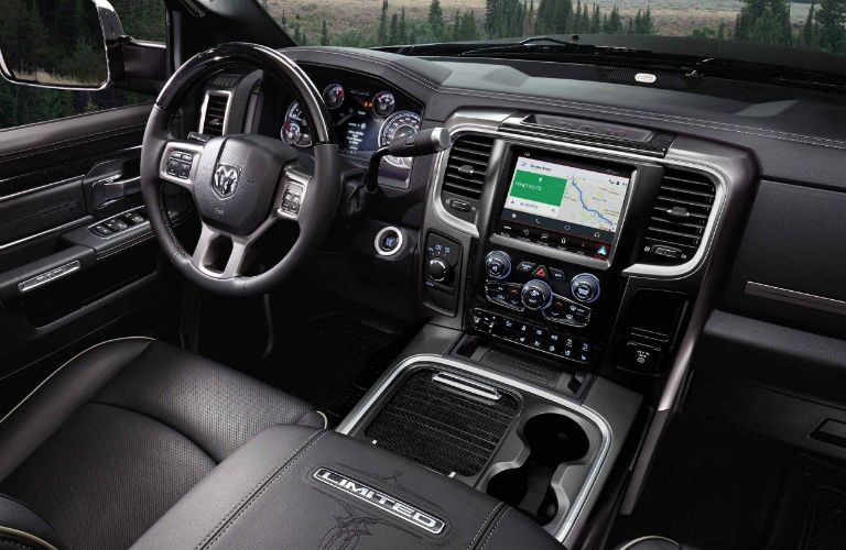 steering wheel and infotainment system of the 2018 Ram 2500 Limited