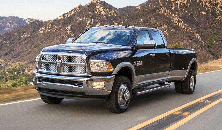 2016 Ram 3500 driving against a backdrop of mountains