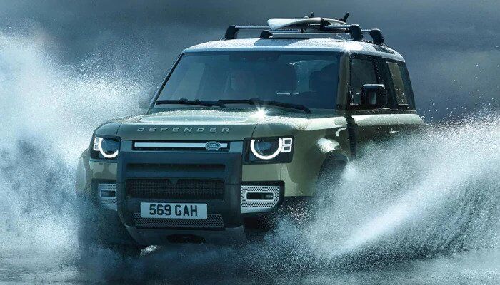 Land Rover Defender driving through water