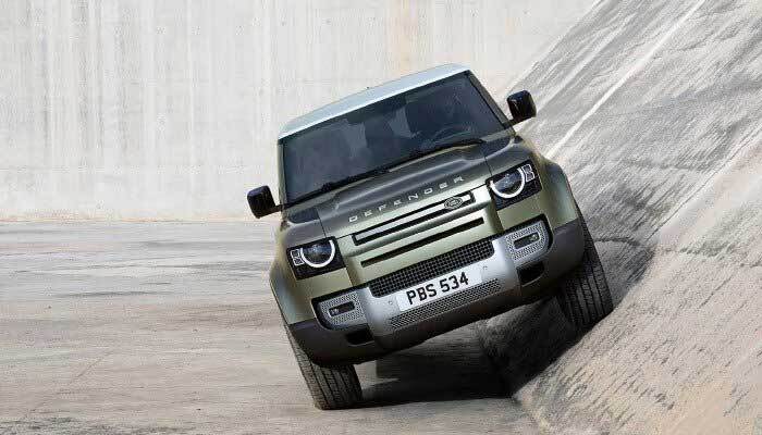 Land Rover Defender riding up an aqueduct