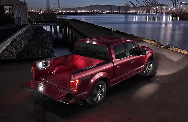 maroon 2016 Ford F-150 at night