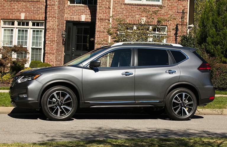 2018 Nissan Rogue Side View of Gray Exterior in front of brick house