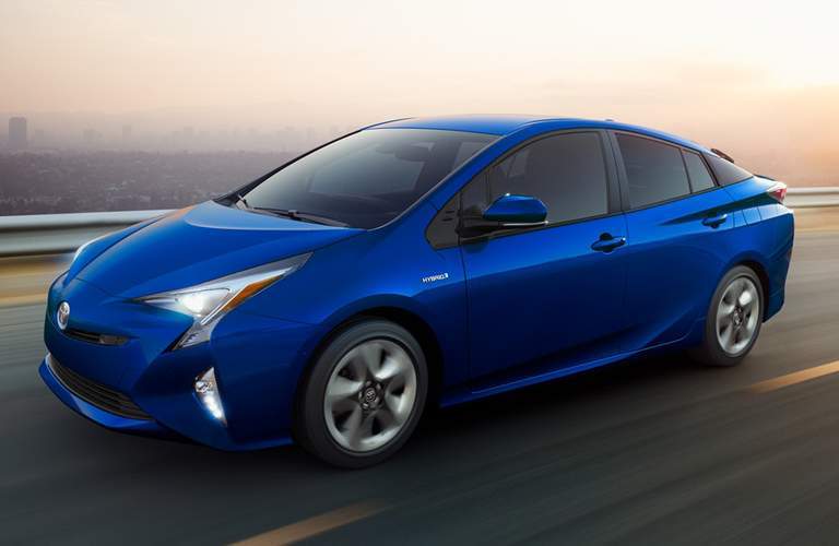 blue toyota prius near water
