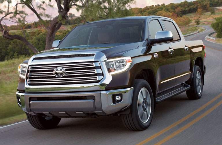 black toyota tundra driving on road