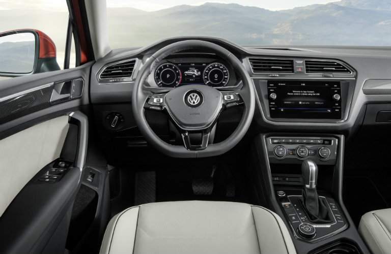 Front dash of 2018 Volkswagen Tiguan with steering wheel and VW Car-Net App-Connect infotainment system