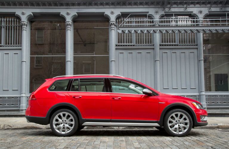 Side profile of red 2017 Volkswagen Golf Alltrack