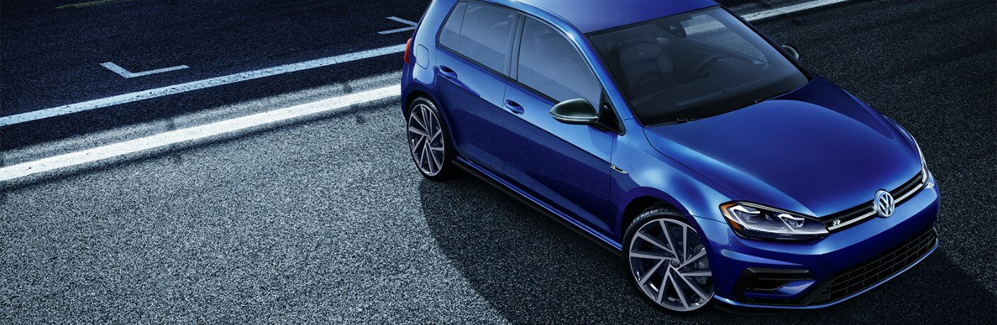 Overhead view of blue 2019 Volkswagen Golf R on city street