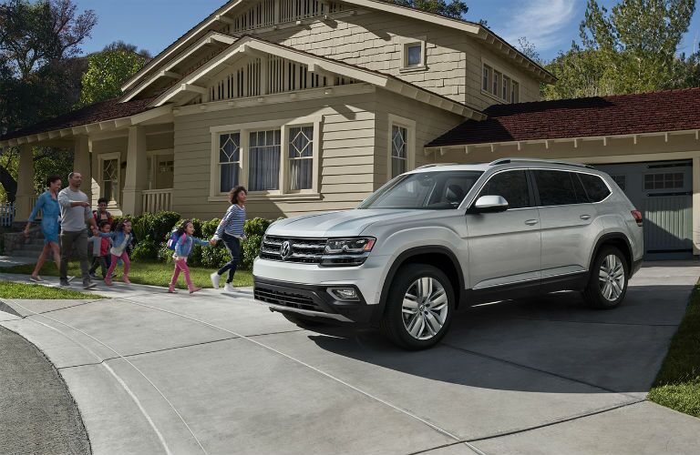A photo of the a family getting into the 2019 VW Atlas.
