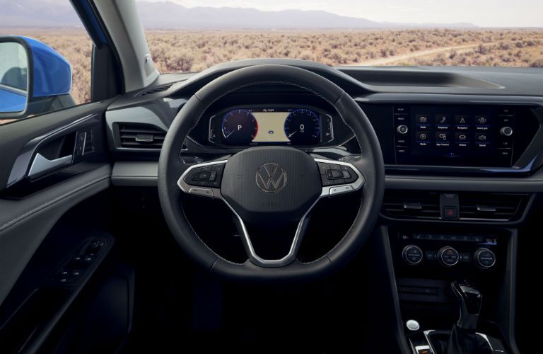 A photo of the driver's cockpit in the 2022 Volkswagen Taos.