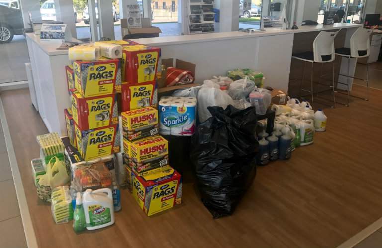 hurricane relief supplies from Team Gunther piled in front of a front desk