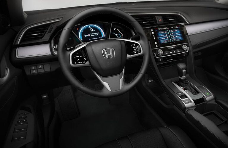 front interior of 2018 honda civic sedan including steering wheel and infotainment system