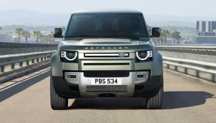 Land Rover Defender driving through city
