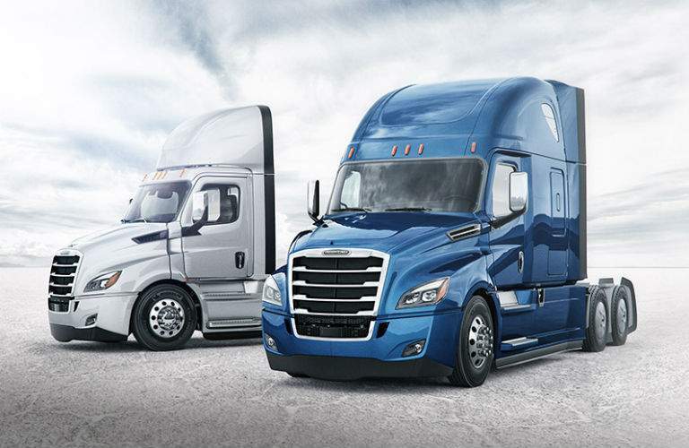 Two Freightliner Cascadia Models Exterior Driver Side Front
