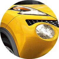 yellow 2017 Nissan Juke headlights closeup