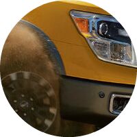 yellow 2017 Nissan Titan headlight closeup