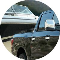 black 2017 Nissan Titan towing boat closeup
