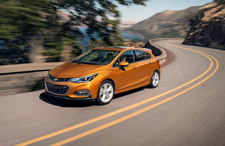 2017 orange Chevy Cruze on highway