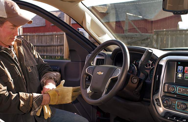 Man entering cab of 2018 Chevy Silverado 3500HD