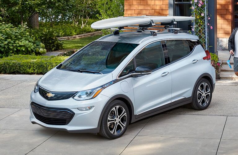2018 Chevy Bolt EV parked with surf board on top of roof