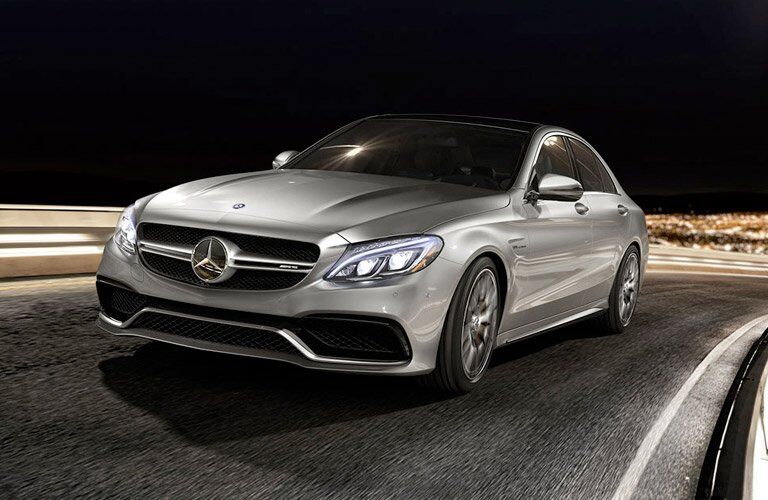 front side view of the 2017 Mercedes-Benz C-Class on the road with a slightly blurred road