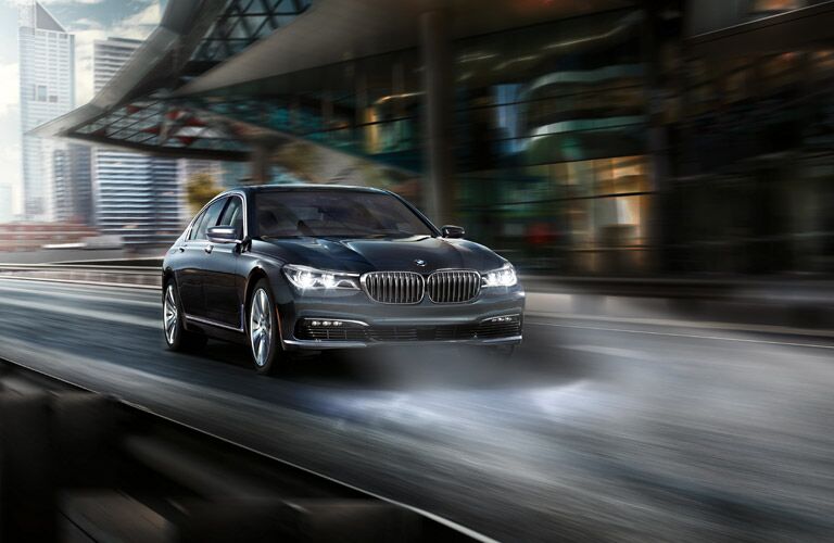 BMW 7 Series Exterior View with Headlights on Black Exterior