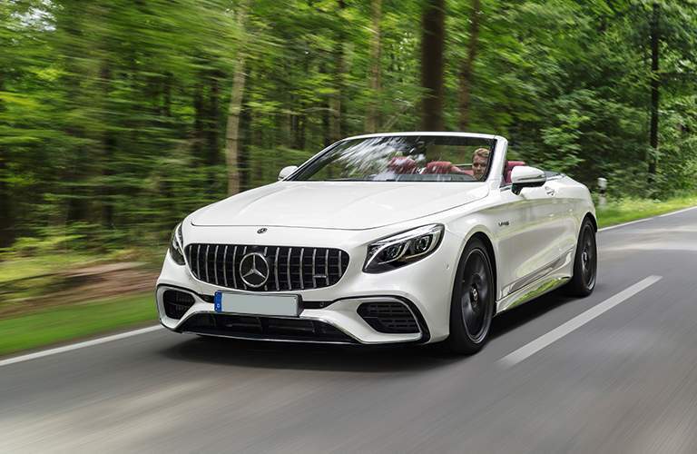 2018 Mercedes-Benz S-Class Cabriolet driving on road in forest.