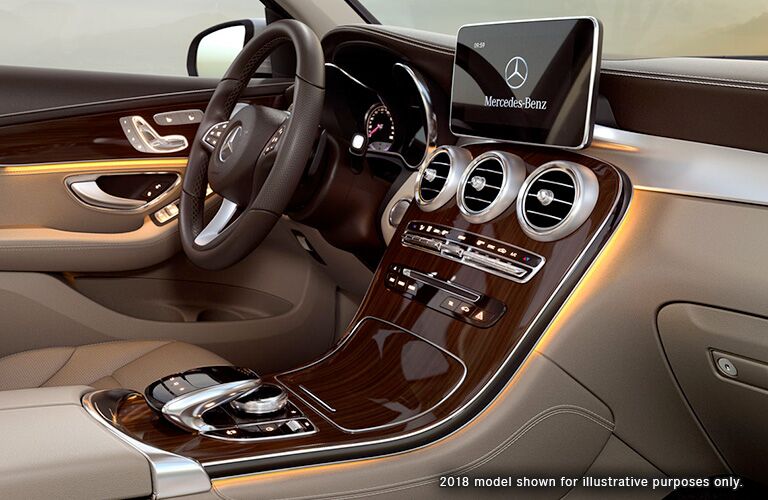side view of front interior of 2019 mercedes-benz glc 300 including steering wheel and infotainment screen