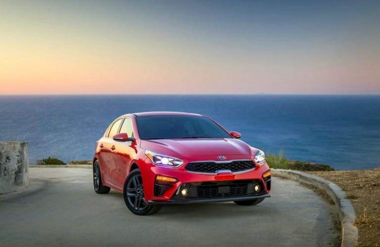 2019 Kia Forte Front End View in Red Parked by Water