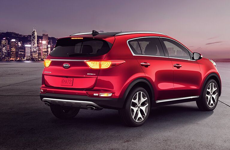 red 2019 Kia Sportage in front of the city